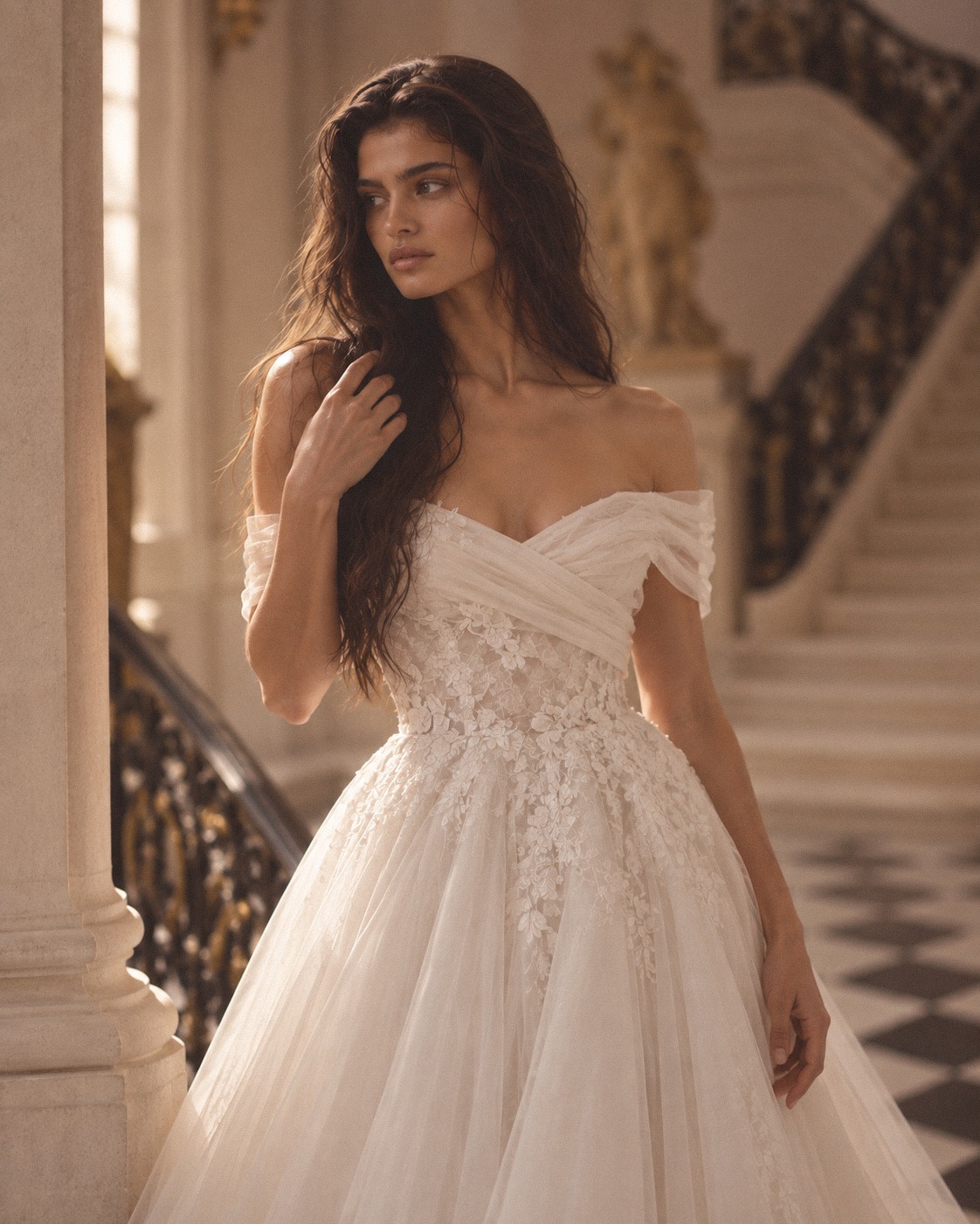 Bridal portrait in embroidered tulle beside an ornate balustrade
